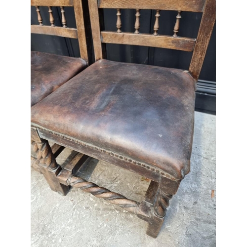 1079 - An unusual pair of Victorian carved oak side chairs, the backs carved with a horse, stirrups and oth... 