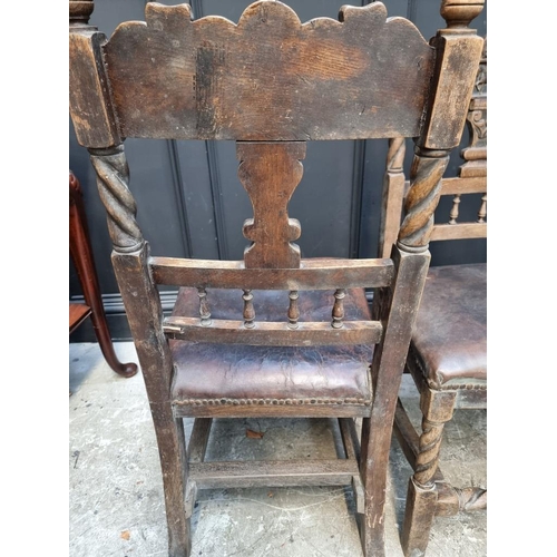 1079 - An unusual pair of Victorian carved oak side chairs, the backs carved with a horse, stirrups and oth... 