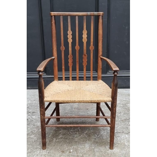 1080 - A Liberty style beech and rush elbow chair, in the manner of Morris & Co. 