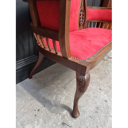 1085 - A circa 1900 carved mahogany and brass studded red suede settee, 124cm wide.