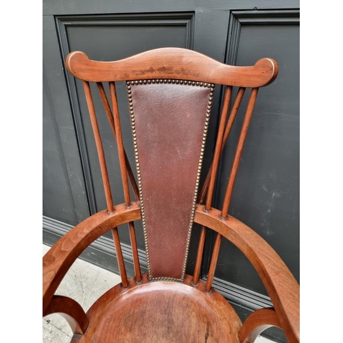 1088 - An unusual circa 1900 mahogany elbow chair, stamped 'Liberty & Co'. 