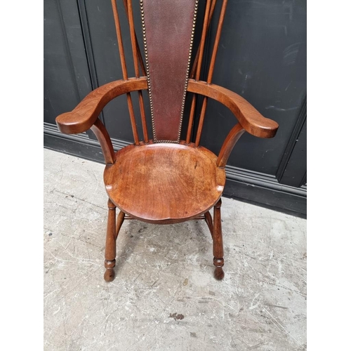 1088 - An unusual circa 1900 mahogany elbow chair, stamped 'Liberty & Co'. 