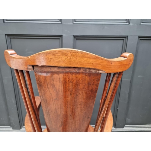 1088 - An unusual circa 1900 mahogany elbow chair, stamped 'Liberty & Co'. 