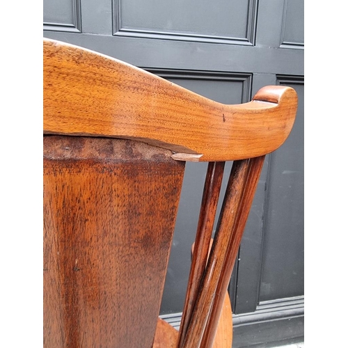 1088 - An unusual circa 1900 mahogany elbow chair, stamped 'Liberty & Co'. 