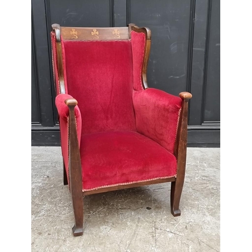 1091 - A circa 1900 mahogany and inlaid wing armchair.  