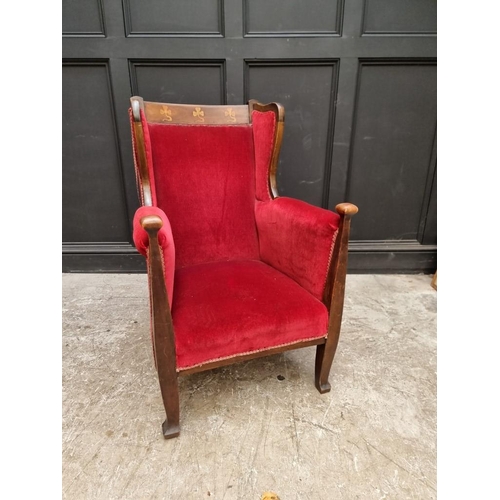 1091 - A circa 1900 mahogany and inlaid wing armchair.  