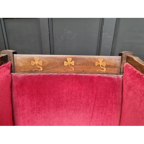 1091 - A circa 1900 mahogany and inlaid wing armchair.  