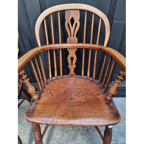 1097 - Two similar Victorian ash and elm stick back Windsor armchairs, each with crinoline stretcher.... 