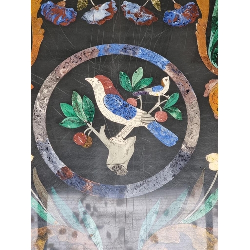 1103 - A large slate and pietra dura table top, 105cm wide, on lacquered brass low stand, (shallow chi... 