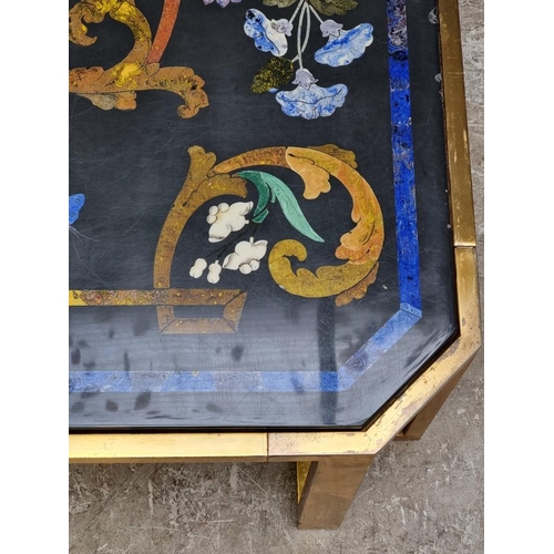 1103 - A large slate and pietra dura table top, 105cm wide, on lacquered brass low stand, (shallow chi... 