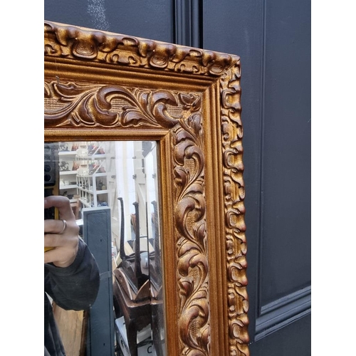 1106 - A large gilt framed rectangular wall mirror, 171 x 109.5cm.