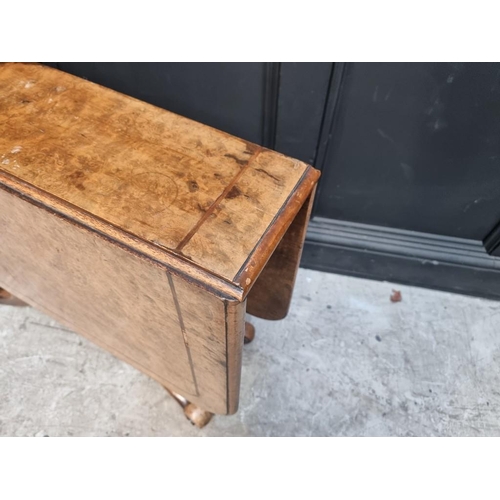 1112 - An unusual Victorian burr walnut Sutherland table, with gateleg action, 106.5cm when open. ... 