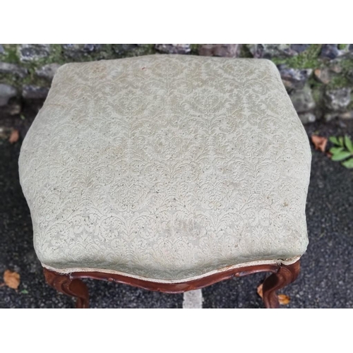 1113 - A Victorian walnut and upholstered stool, 60cm wide, (feet re-tipped). 