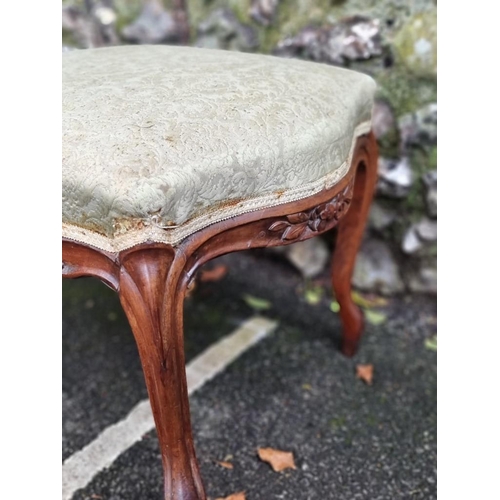 1113 - A Victorian walnut and upholstered stool, 60cm wide, (feet re-tipped). 