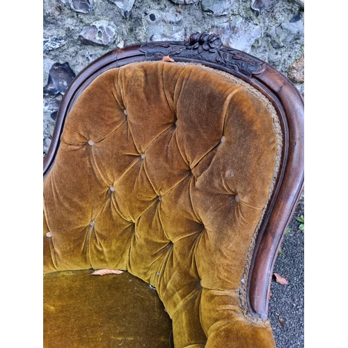 1117 - A Victorian carved and pierced walnut chaise longue.