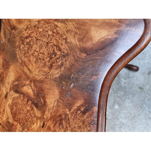 1125 - A Victorian burr walnut occasional table, with quarter veneered and shaped top, 90.5cm wide.... 