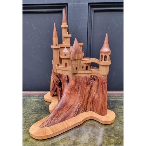 1159 - An oak fantasy castle, 38cm high.  