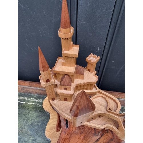 1159 - An oak fantasy castle, 38cm high.  