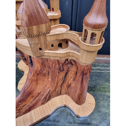 1159 - An oak fantasy castle, 38cm high.  