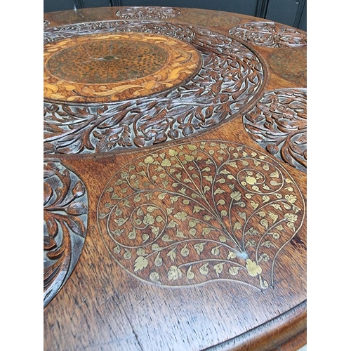 1109 - A Indian carved hardwood, brass and inlaid circular low occasional table, 90cm diameter.... 