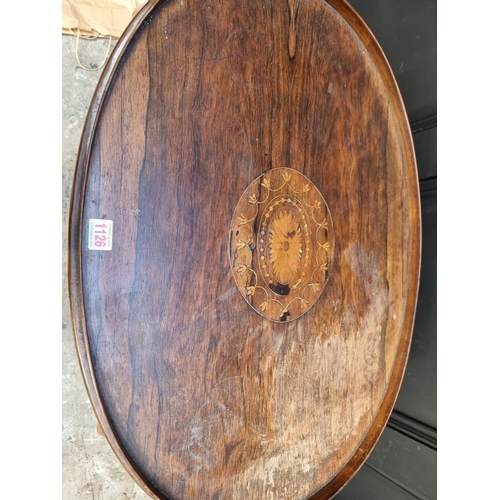 1126 - A circa 1900 rosewood and inlaid oval two-tier occasional table, 73cm wide.