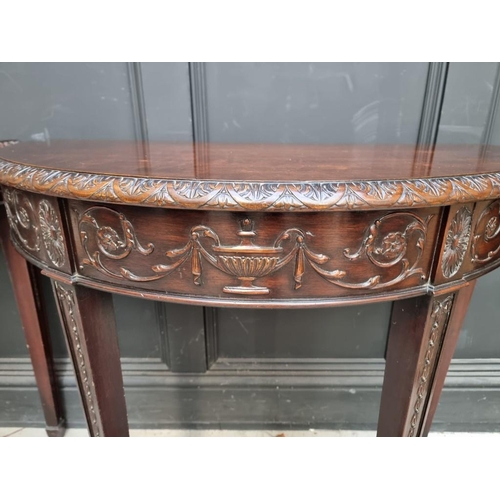 1127 - A pair of late 19th /early 20th century carved mahogany demi lune console tables, in the Robert Adam... 