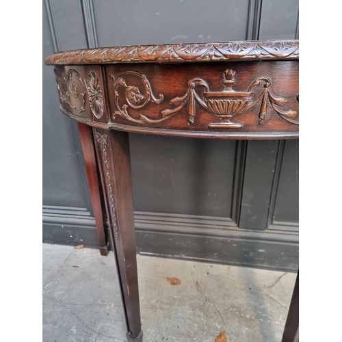 1127 - A pair of late 19th /early 20th century carved mahogany demi lune console tables, in the Robert Adam... 