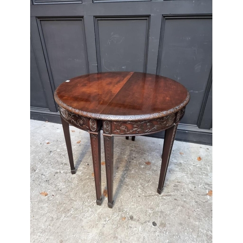 1127 - A pair of late 19th /early 20th century carved mahogany demi lune console tables, in the Robert Adam... 