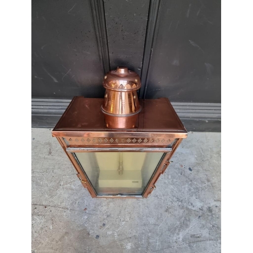 1151 - A copper wall lantern, 49cm high. 