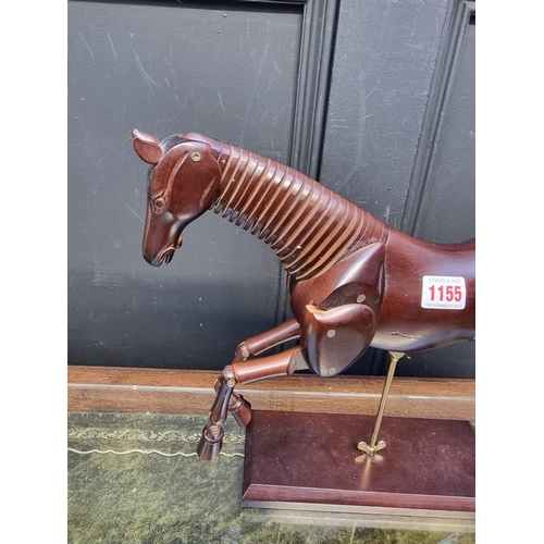 1155 - A reproduction stained wood articulated horse, 31.5cm high.