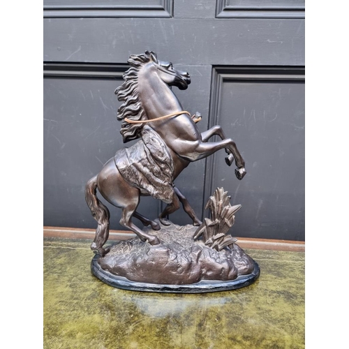 1158 - After Guillaume Coustou, a bronze spelter Marly horse, 41cm high.