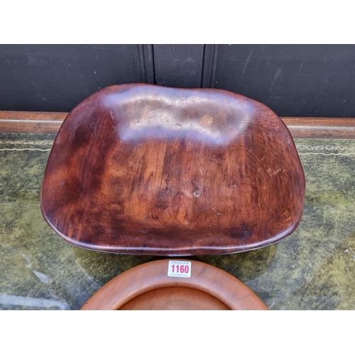 1160 - Two New Zealand kauri wood bowls, each inscribed to base, largest 41cm wide.