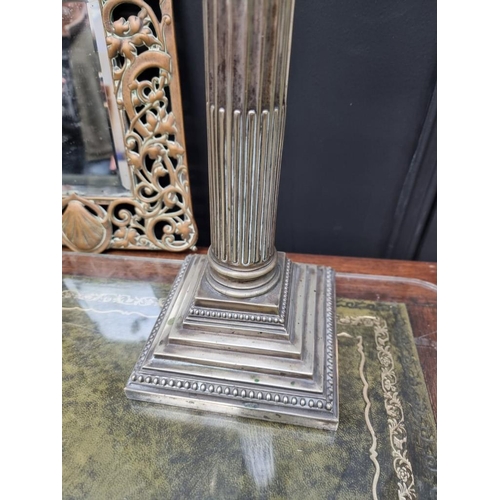 1166 - A cast brass framed mirror, 38 x 24.5cm; together with an electroplated Corinthian column table lamp... 