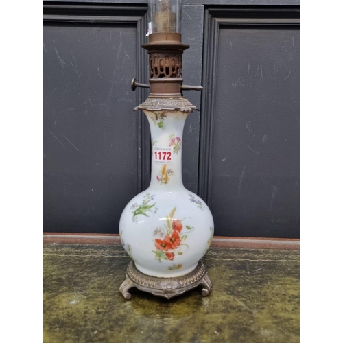 1172 - A French porcelain and brass oil lamp, height excluding chimney 33.5cm.