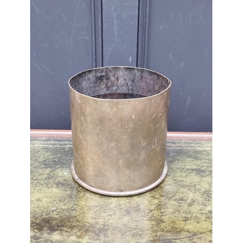 1173 - A Trench Art brass waste paper bin, 22cm high.