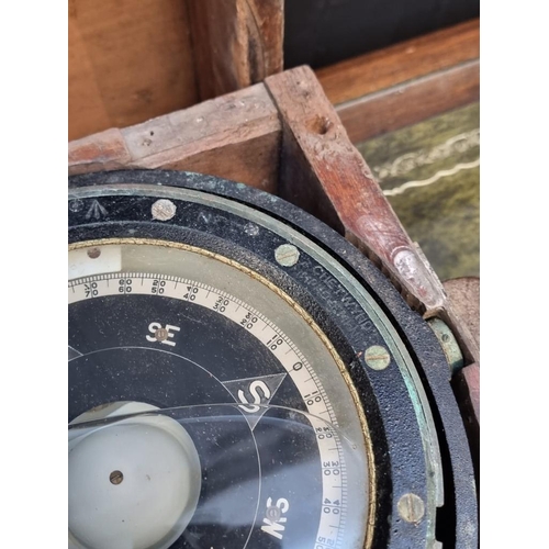 1175 - A ship's gimbal compass, in wood case with broad arrow stamp, 26cm wide.