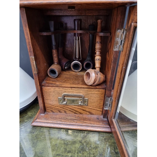 1185 - Tobacciana: an oak combined cigar and cigarette box, 26cm wide; together with an oak smokers' cabine... 