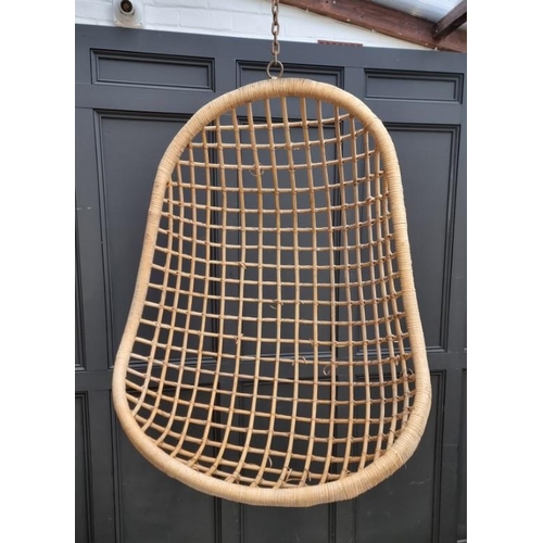 1199 - A vintage cane and rattan hanging egg chair. 