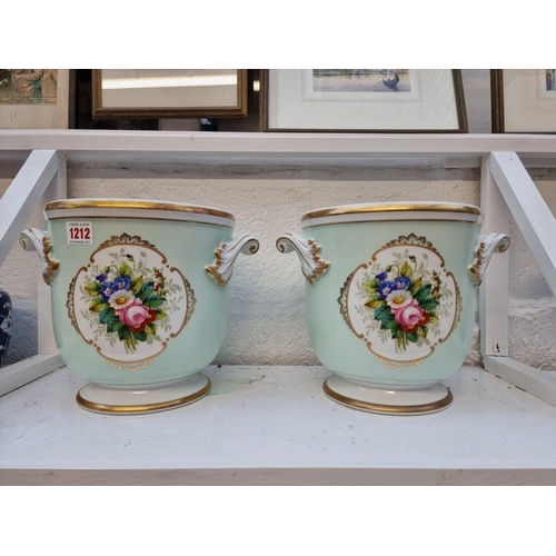 1212 - A pair of Continental porcelain twin handled cachepots, painted with flowers, 22cm high.... 