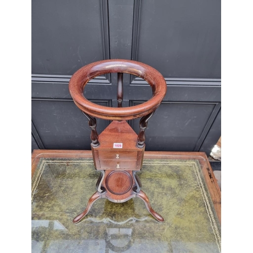 1028 - A George III mahogany tripod shaving stand, with turned bone knobs. 