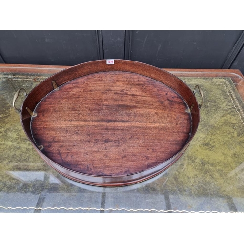 1074 - A George III mahogany oval gallery tray, 80.5cm wide.  