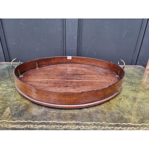 1074 - A George III mahogany oval gallery tray, 80.5cm wide.  