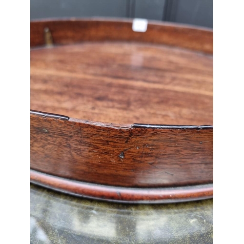 1074 - A George III mahogany oval gallery tray, 80.5cm wide.  