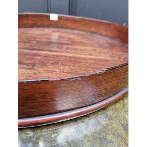 1074 - A George III mahogany oval gallery tray, 80.5cm wide.  