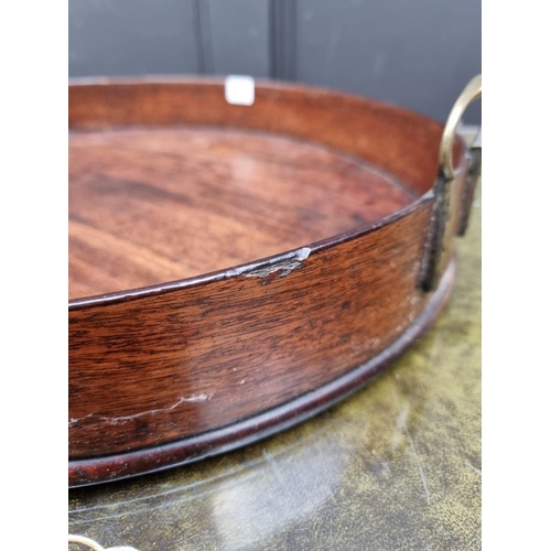 1074 - A George III mahogany oval gallery tray, 80.5cm wide.  