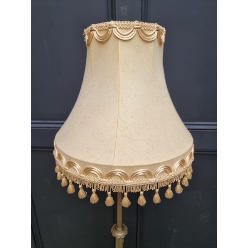 1228 - A brass tripod standard lamp, height including shade 165cm. 