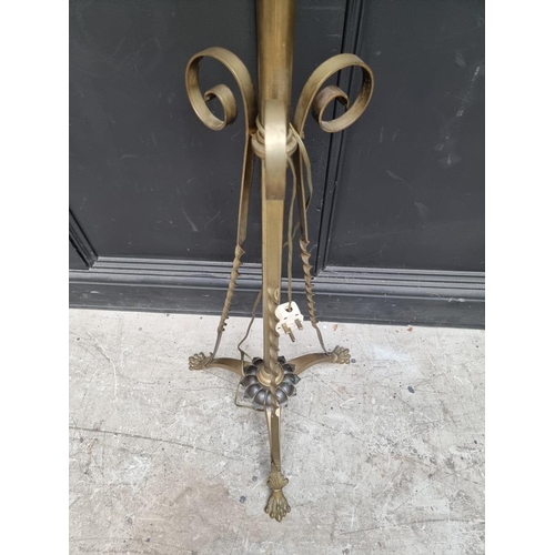 1228 - A brass tripod standard lamp, height including shade 165cm. 