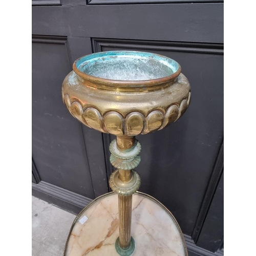 1229 - A brass and onyx tripod stand, 124cm high. 