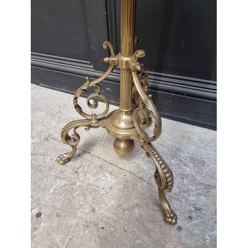 1229 - A brass and onyx tripod stand, 124cm high. 