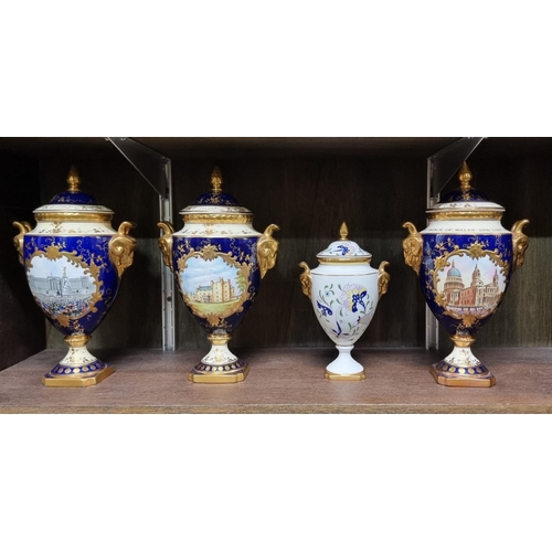 1404 - Three Coalport limited edition twin handled urns and covers, 24cm high; together with another s... 